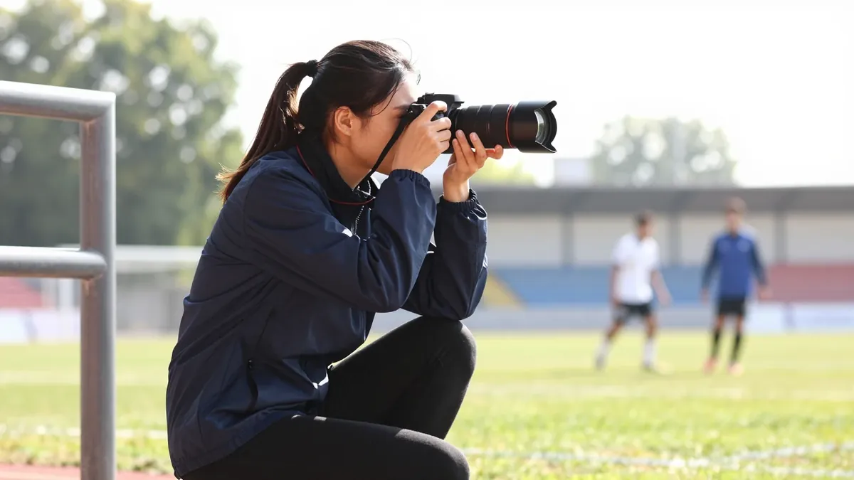 Edinburgh College student Chantelle Cook is shadowing Motherwell FC club photographer Raymond Davies to master the craft...